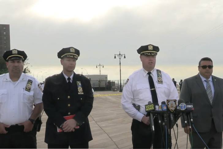 Police officers are pictured at a press conference.